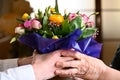 Beautiful bouquet of fresh flowers in hands.