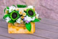 Beautiful bouquet with green sunflowers in a wooden gift box in a rustic style. The concept of memories of summer