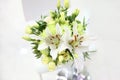 Beautiful bouquet of light green eustoma, chrysanthemum and whit