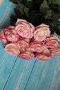 A beautiful bouquet of pink roses on a wooden surface. Royalty Free Stock Photo