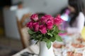 Beautiful bouquet of pink roses in vase on the table Royalty Free Stock Photo