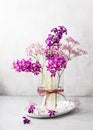 Beautiful bouquet of purple hyacinth and pink gypsophila flowers in a glass vase. Royalty Free Stock Photo