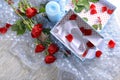 Beautiful bouquet of red roses and gift box on table Royalty Free Stock Photo