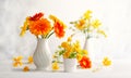 Beautiful bouquet of red and yellow flowers in white vase on wooden table, front view. Autumn still life with flowers Royalty Free Stock Photo