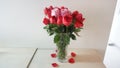 Beautiful bouquet of roses in jars on table with white background. Wedding bouquet of red rose