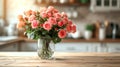 A beautiful bouquet of roses stands in a glass vase on a wooden table Royalty Free Stock Photo