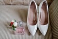 Beautiful bouquet, shoes and perfume bottle for bride and groom