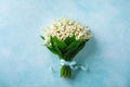 Beautiful bouquet of spring flowers lily of the valley top view. Mother Day or wedding mockup concept