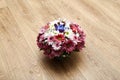 Beautiful bouquet from spring flowers on a wooden background