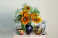 Beautiful bouquet of sunflowers in a vase and black currant berries. Still life with flowers and berries Royalty Free Stock Photo