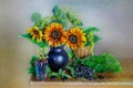 Still life bouquet of sunflowers in a vase and black currant berries. Still life with flowers and berries Royalty Free Stock Photo