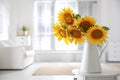 Beautiful bouquet of sunflowers in vase on table indoors. Space for text Royalty Free Stock Photo