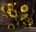 Beautiful bouquet of sunflowers in vase on a wooden table Royalty Free Stock Photo