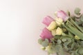 Beautiful bouquet of tulips and bushy little yellow rose on pink background, flat lay with copy space, effect of old photo with