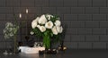 Beautiful bouquet of roses in a vase, candles, books, home fragrance on the background of black tiles Royalty Free Stock Photo