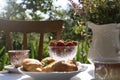 Beautiful bouquet of wildflowers on table served for tea drinking in garden, closeup Royalty Free Stock Photo