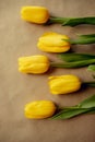 beautiful bouquet of yellow tulips on craft paper. gifts for moms, spring holidays, Flowers packaging Royalty Free Stock Photo