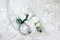 Beautiful boutonniere with ring on white wedding dress, closeup Royalty Free Stock Photo