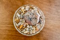 A bowl of rocks sits as a center piece for a table decoration in a person`s home.