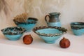 Beautiful bowls and a jug stand on the table