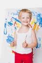 Beautiful boy painting with paintbrush on canvas. Education. Creativity Royalty Free Stock Photo