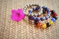 Beautiful bracelets placed on the wooden background