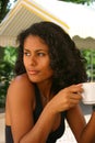 Beautiful brazilian woman drinking coffee