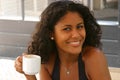 Beautiful brazilian woman having a coffee