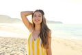 Beautiful brazilian woman in summer dress on tropical beach. Portrait of happy young woman smiling at sea. Happy cheerful girl Royalty Free Stock Photo