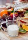 Beautiful breakfast. Milk fruits, bread and croissant.