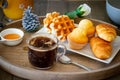 Beautiful breakfast or snack with croissant muffins waffles and coffee Royalty Free Stock Photo