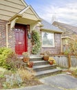 Beautiful brick house with red entrance door Royalty Free Stock Photo