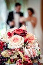 Beautiful bridal bouquet and bride and groom on background, selective focus Royalty Free Stock Photo