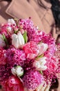 Beautiful bridal bouquet in pink lilac tones made of hyacinth, tulips and gypsophila. Royalty Free Stock Photo