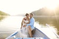 Beautiful bridal couple embracing in a boat