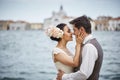 Beautiful bridal couple at sunset on the streets of Venice Royalty Free Stock Photo