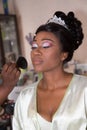 Bride applying wedding make up for black skin african american wedding woman