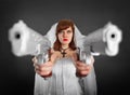 Beautiful bride armed with two pistols Royalty Free Stock Photo