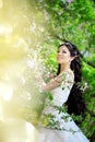 Beautiful bride in a blossoming garden