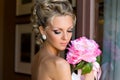 Beautiful bride with bunch of flowers.