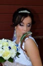 Beautiful bride with a chameleon and flowers