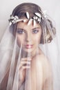 Beautiful bride with fashion wedding hairstyle - on white background Royalty Free Stock Photo