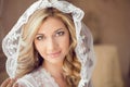 Beautiful bride with fashion wedding hairstyle in white veil. Cl Royalty Free Stock Photo