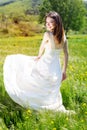 Beautiful bride girl in the yellow field