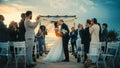 Beautiful Bride and Groom Celebrate Wedding Outdoors on a Beach Near the Ocean at Sunset. Perfect Royalty Free Stock Photo