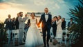 Beautiful Bride and Groom Celebrate Wedding Outdoors on a Beach Near the Ocean at Sunset. Perfect Royalty Free Stock Photo