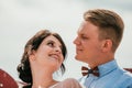 Beautiful bride and groom hugging and kissing on their wedding day outdoors. Concept wedding, new family. Royalty Free Stock Photo