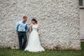 Beautiful bride and groom hugging and kissing on their wedding day outdoors. Concept wedding, new family. Royalty Free Stock Photo