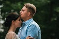 Beautiful bride and groom hugging and kissing on their wedding day outdoors. Concept wedding, new family. Royalty Free Stock Photo