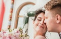 Beautiful bride and groom hugging and kissing on their wedding day outdoors. Concept wedding, new family. Royalty Free Stock Photo